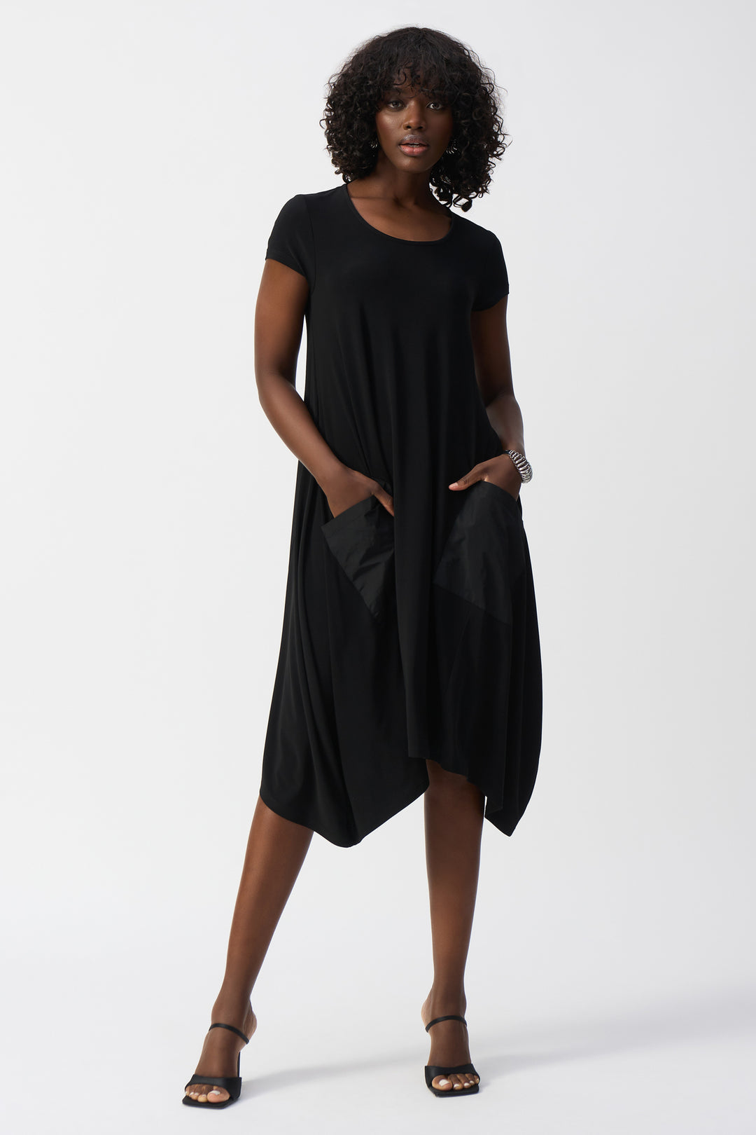 Joseph Ribkoff Spring 2025  Classic, light and airy, our dress is the perfect choice for any adventure. Stay comfortable and stylish with its breathable fabric and convenient front memory pockets. 