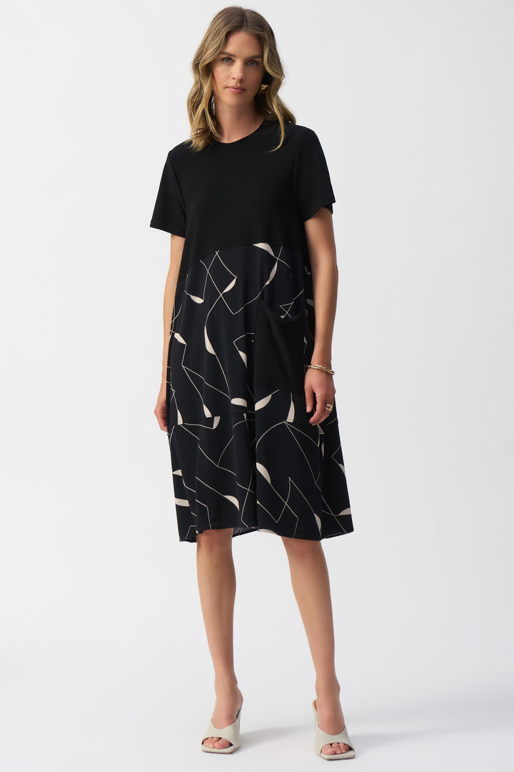 Joseph Ribkoff Spring 2025 The geometric print with a solid black top adds a touch of contrast, making it easy to dress up or down. Elevate your style with this versatile trapeze dress.