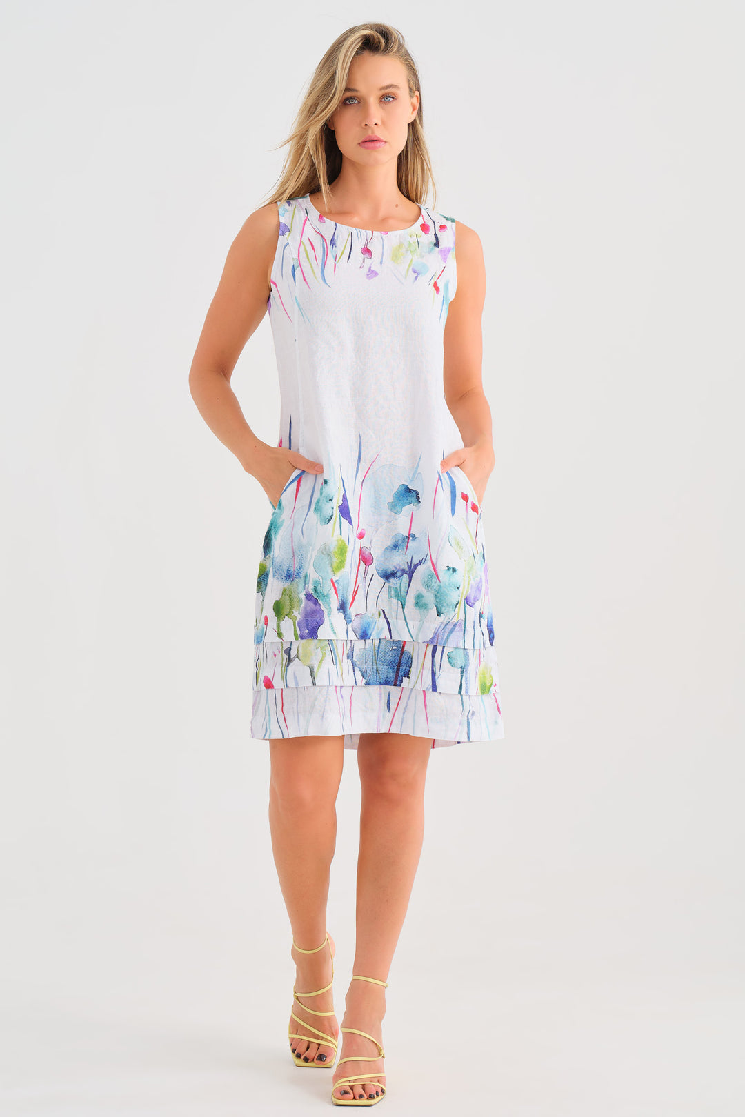 Dolcezza Spring 2025 This timeless summer classic is crafted from light linen, perfect for warm days. With a fresh spring print, side pockets and a unique pleated hem design, this dress is truly a wonder.