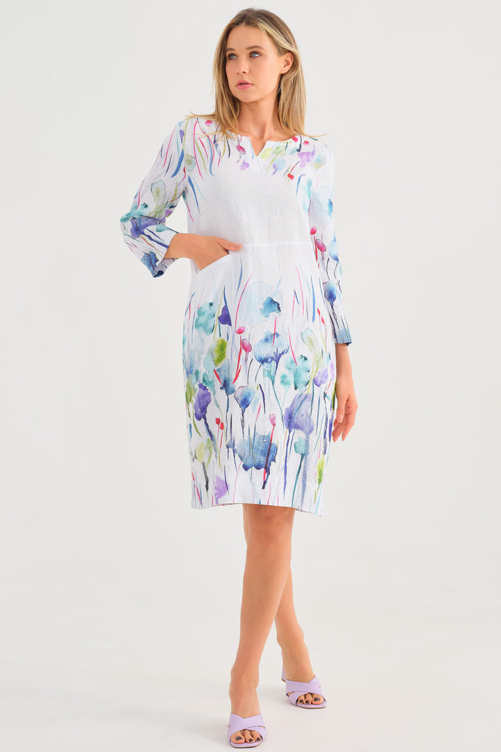 Dolcezza Spring 2025  This dress also features three quarter length sleeves, pockets, side slits all coming together in this loose fitting comfortable dress. 