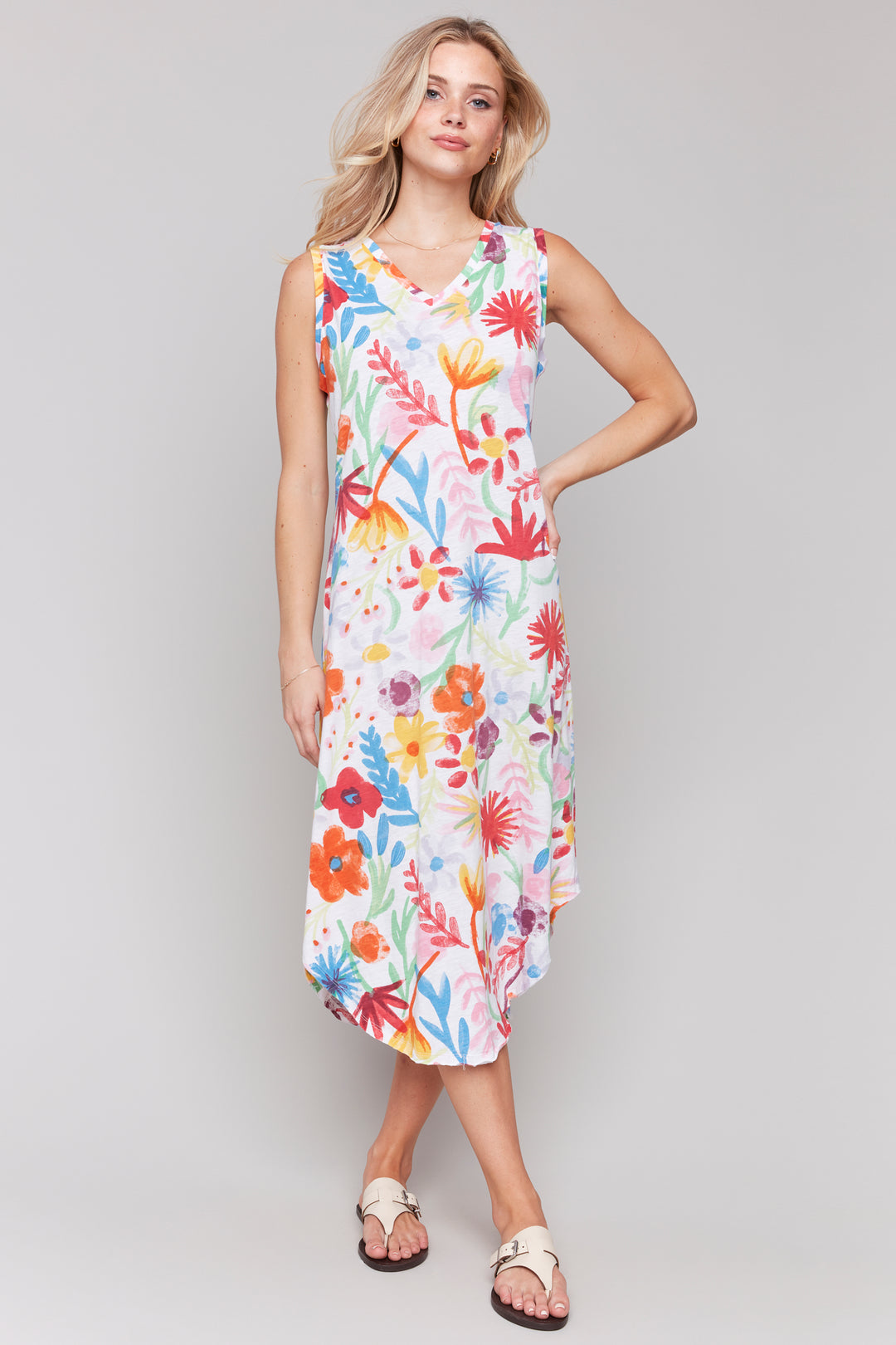 Charlie B Spring 2025  Made of all cotton, it features a v-neck and double stitched hem for durability. The light and loose fit provides comfort, while the spring flowers print all-over adds a touch of whimsy. 