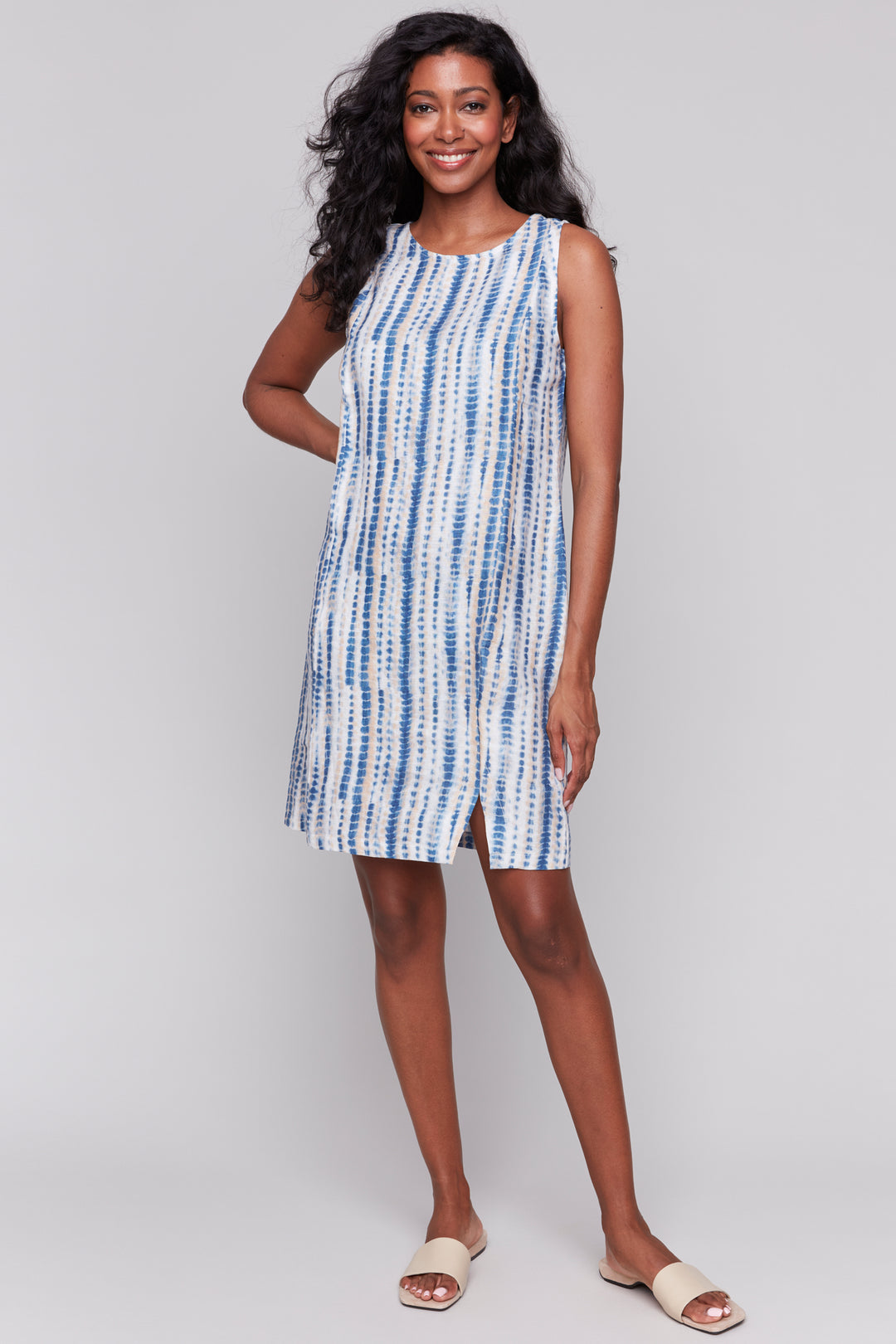 Charlie B Spring 2025  Designed with side slit cut details and a knee length style, this dress is perfect for showing off your adventurous side. 