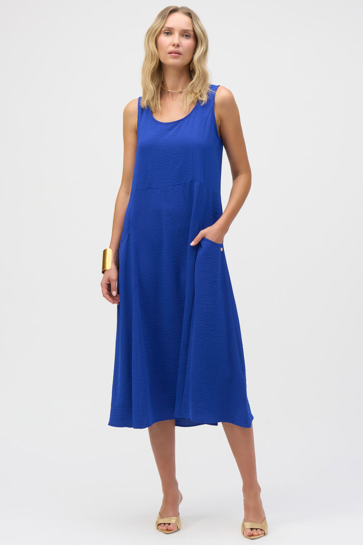 Joseph Ribkoff Spring 2025 This dress features side pockets, a scoop neck, and lightweight gauze fabric for ultimate comfort and style.