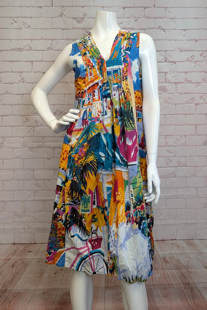 ORIENTIQUE S25  The lively yet laidback sunshine print, complete with Flordia vibes, adds a playful touch to this flowing dress! 