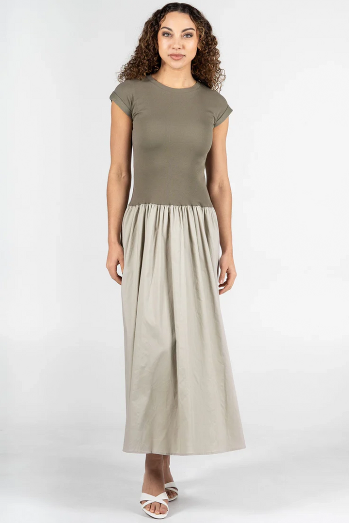 C'EST MOI Spring 2025 This neat design features a comfy crew neck top with cute cap sleeves that seamlessly transitions into a flowing cotton skirt. Perfect for effortless style from day to night, this skirt dress combines comfort and fashion in one delightful package!