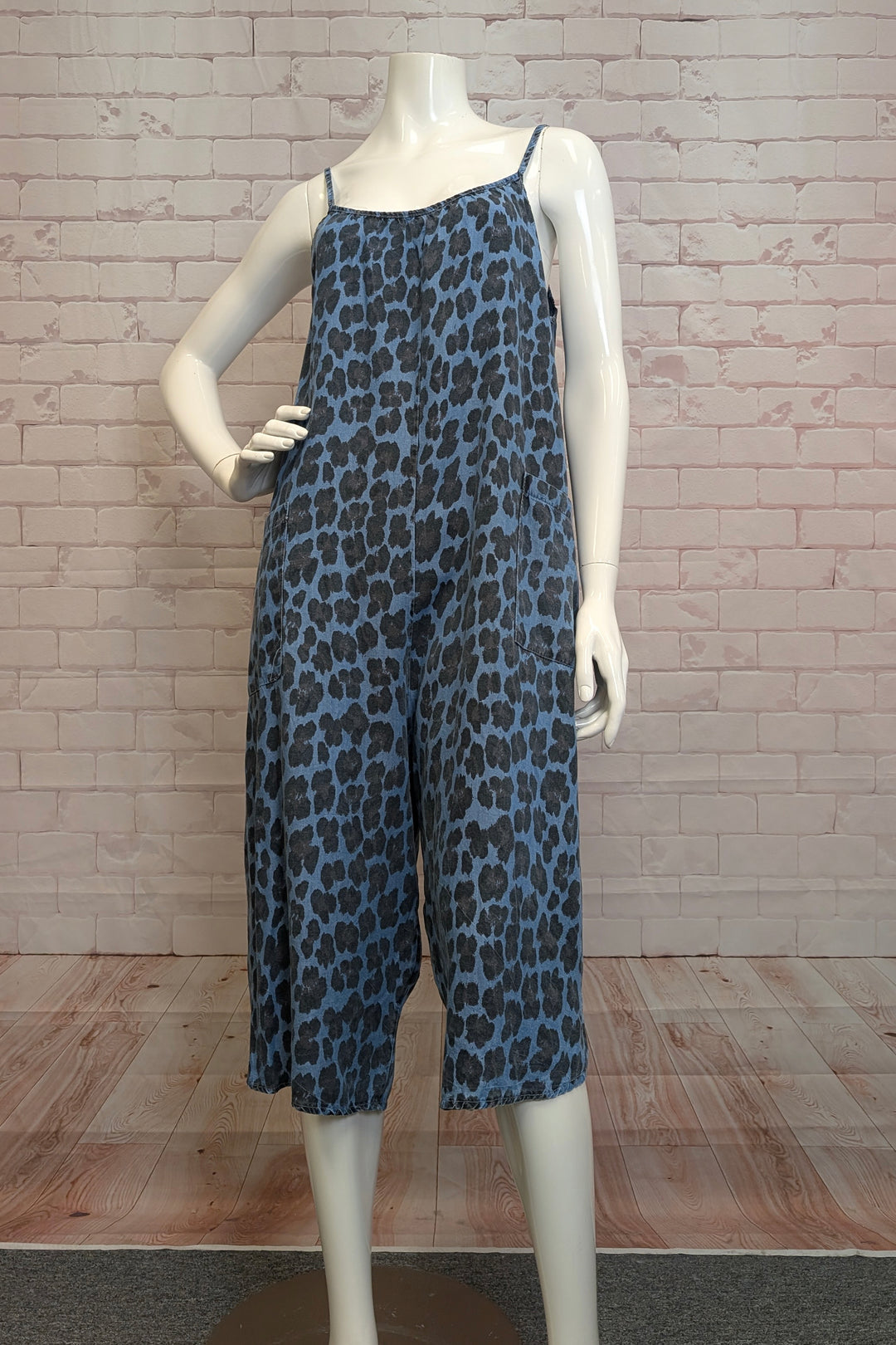 ANGELA MARA Spring 2025  Featuring a fun cheetah print all over, this sleeveless one-piece wonder with spaghetti straps keeps things light and breezy. 
