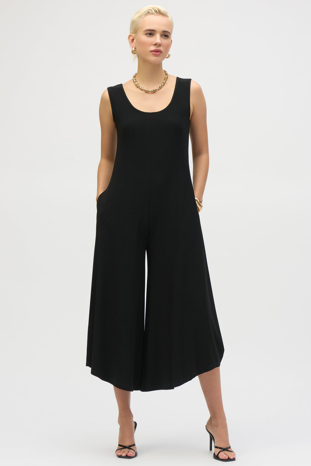JOSEPH RIBKOFF Spring 2025  Crafted from silky smooth fabric, it features a flattering scoop neckline and practical side pockets. Its wide-leg silhouette offers comfort and a graceful drape, making it an ideal choice for special occasions or refined everyday summer wear. 