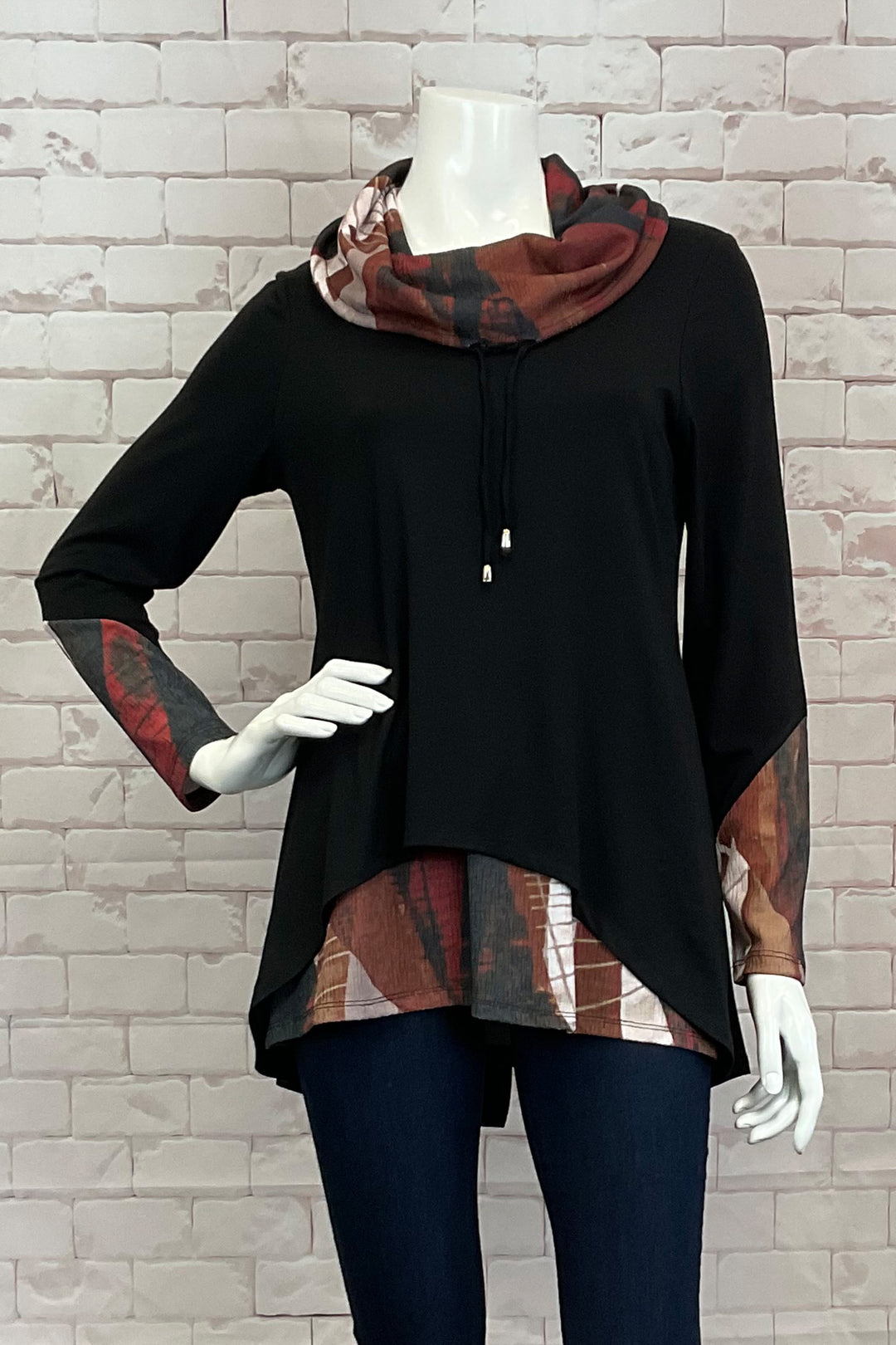 Michael Tyler Fall 2024 Featuring a unique fooler design, the central piece is a stylish cowl neck with a drawstring for added flair.