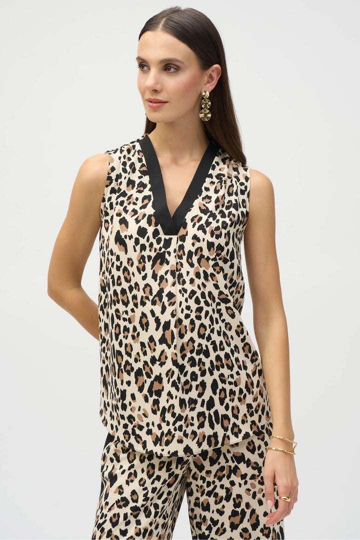 Joseph Ribkoff Spring 2025 The super smooth tiger print adds a touch of ferocity to any outfit, while the bold contrast sharp v-neck and subtle front pleat detail elevate your style.