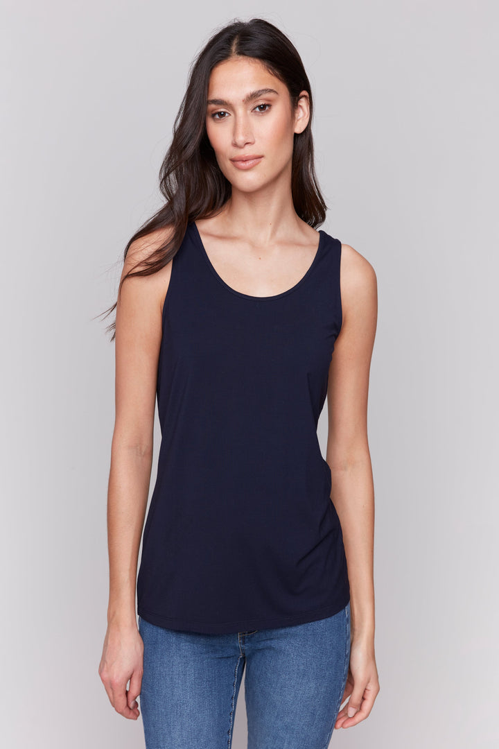 Charlie B Spring 2025 Featuring a flattering scoop neck and or soft cut v-neck, depending on which side you where it, and a light, simple design, this top is perfect for any occasion.