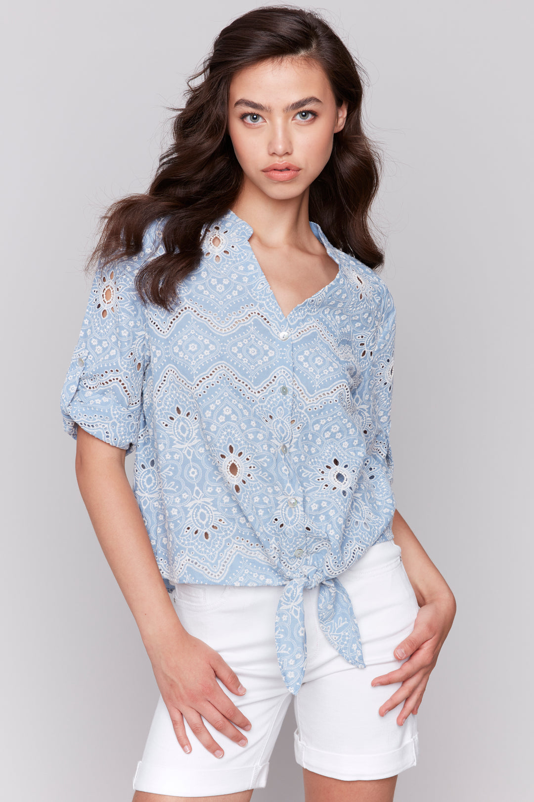 Charlie B Spring 2025 Eyelet embroidered cotton button-down blouse with a front knot tie and front chest pocket. 