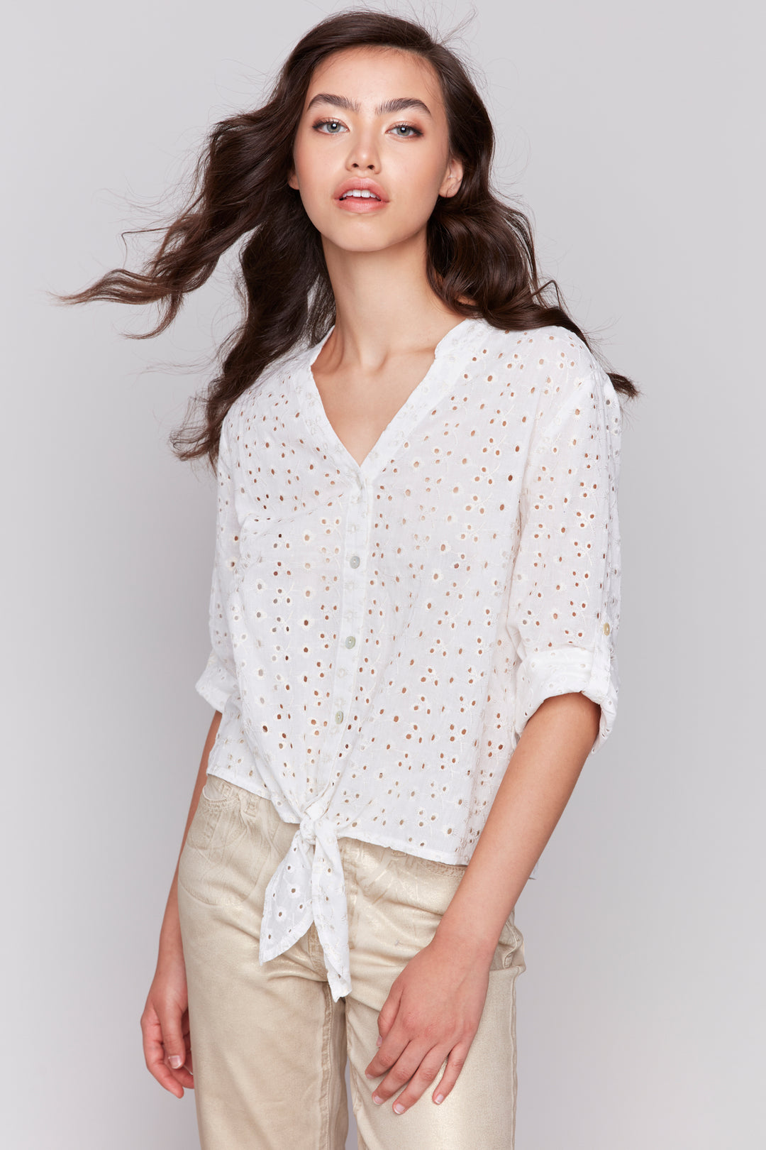 Charlie B Spring 2025  Made of embroidered cotton, it features a split v-neck, front buttons and a tie knot at the hem for an easy, breezy wear. 
