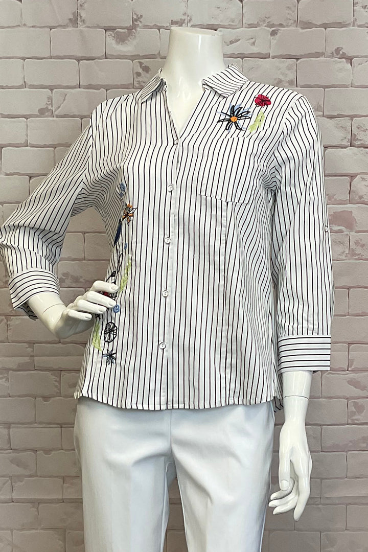 Dolcezza Spring 2025 Made from a cotton blend, this blouse features a pinstripe design and a soft, stretchy fabric for a comfortable fit. The cute floral embroidery adds a touch of elegance, while classic dress shirt elements provide a timeless appeal.