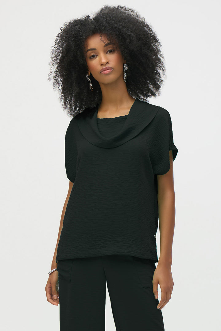 Joseph Ribkoff Spring 2025 With a cowl neckline and half sleeves, it is made from lightweight and breathable gauze fabric, perfect for layering or wearing on its own.