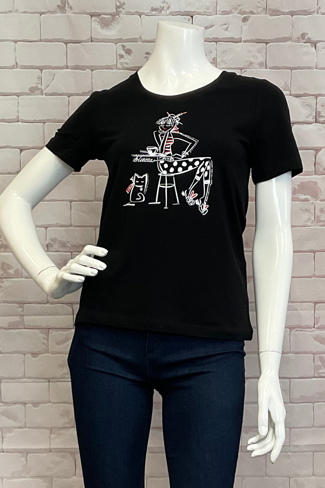 Dolcezza Spring 2025  Made with stretchy cotton fabric, this round neck tee is perfect for any casual occasion. Pair it with your everyday black or blue jeans, shorts, or capris and show off the cool lady with cat &amp; coffee design print! 