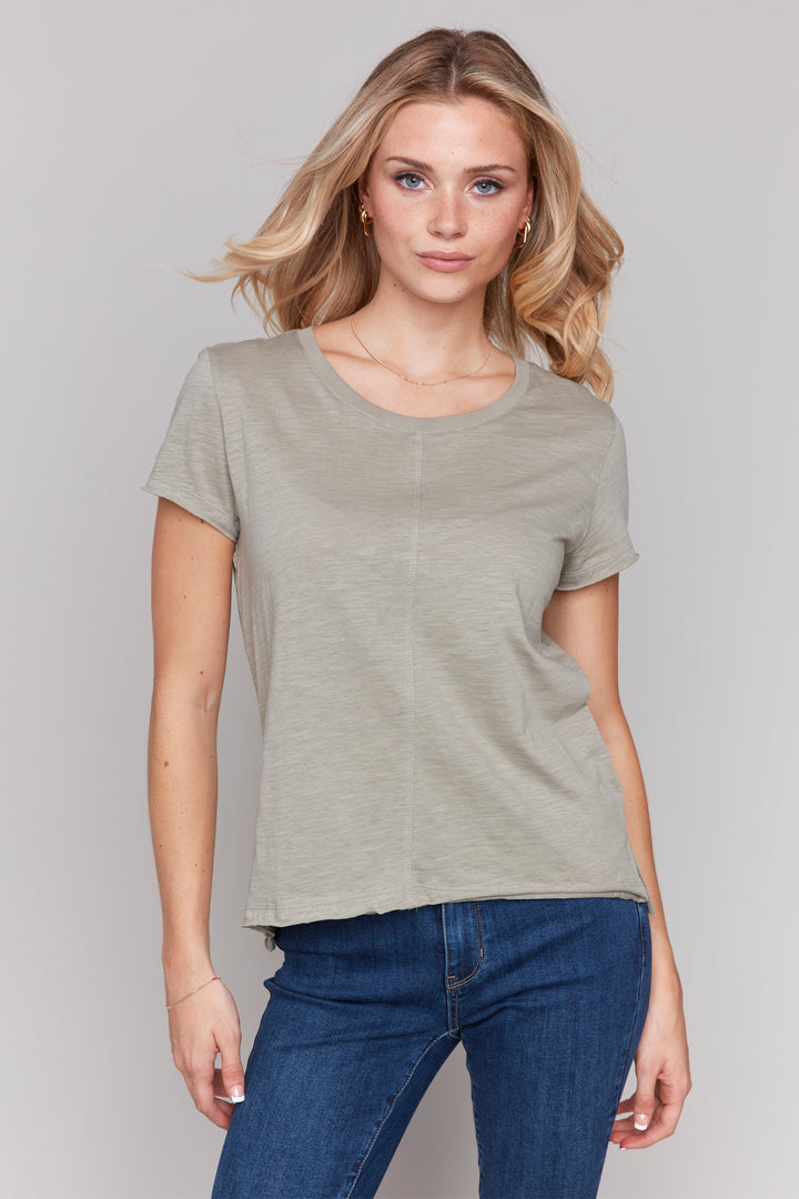 Charlie B Spring 2025 With a round neckline, short sleeves and a comfortable knit fit, this all cotton top is easy to wear and can be dressed up or down.