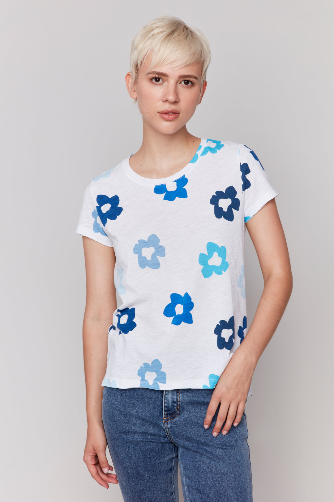 Charlie B Spring 2025 Made with all cotton for a light and comfortable fit, this tee features a cute print of spring flowers. Short sleeves and double stitch hem and cuffs add an extra touch of ease.