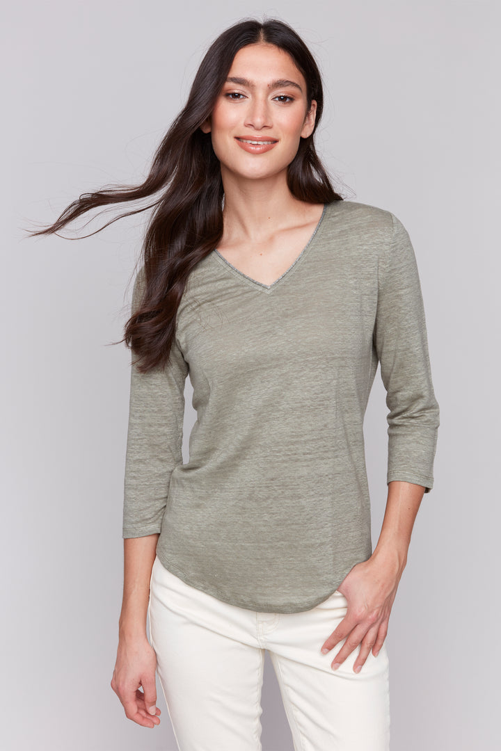 Charlie B Spring 2025 The simple yet neat design makes it versatile and perfect for any casual occasion. The knit fabric, 3/4 length sleeves and contrast v-neck design make it light and comfortable.