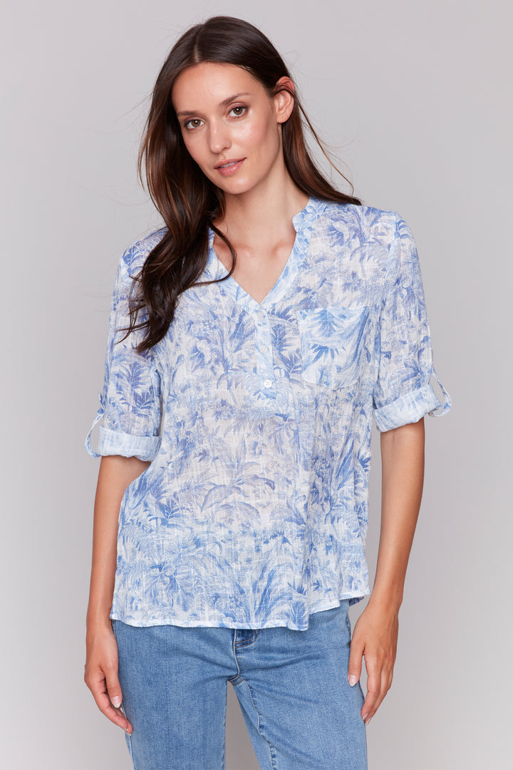 Charlie B Spring 2025 Pull on this light and airy blouse for instant style and comfort this spring and summer season. With its relaxed fit and long sleeves that you can roll up, this blouse is a perfect top for unpredictable weather.