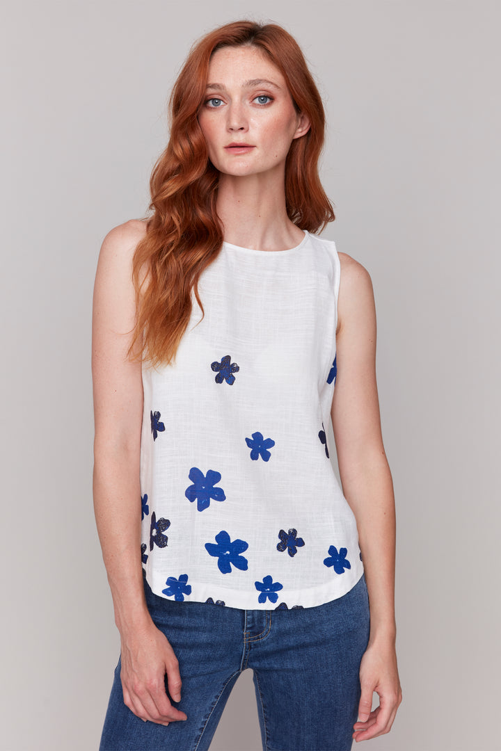 Charlie B Spring 2025 Charlie B Spring 2025  Made of a soft and lightweight woven linen blend, this tank top goes well with shorts, capris jeans and much more! With a rounded hem, crew neckline and flattering cut, you will stay loose and stylish all season long!