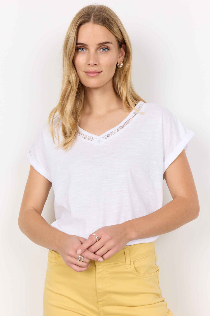 Soya Concept Spring 2025 Made with all organic cotton, it features cap short sleeves for a breezy and casual look. The lovely crochet lace trim v-neck adds a touch of elegance to this basic tee.