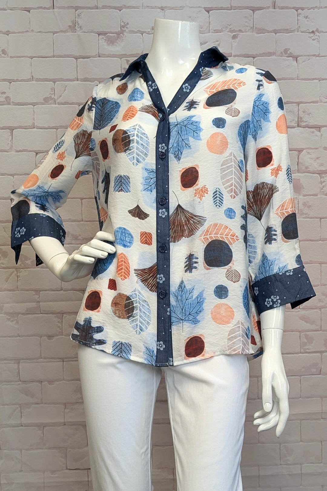 VARIATIONS Spring 2025  The leaves floral print adds a touch of whimsy, while the bold border neckline and cuffs make a statement. 