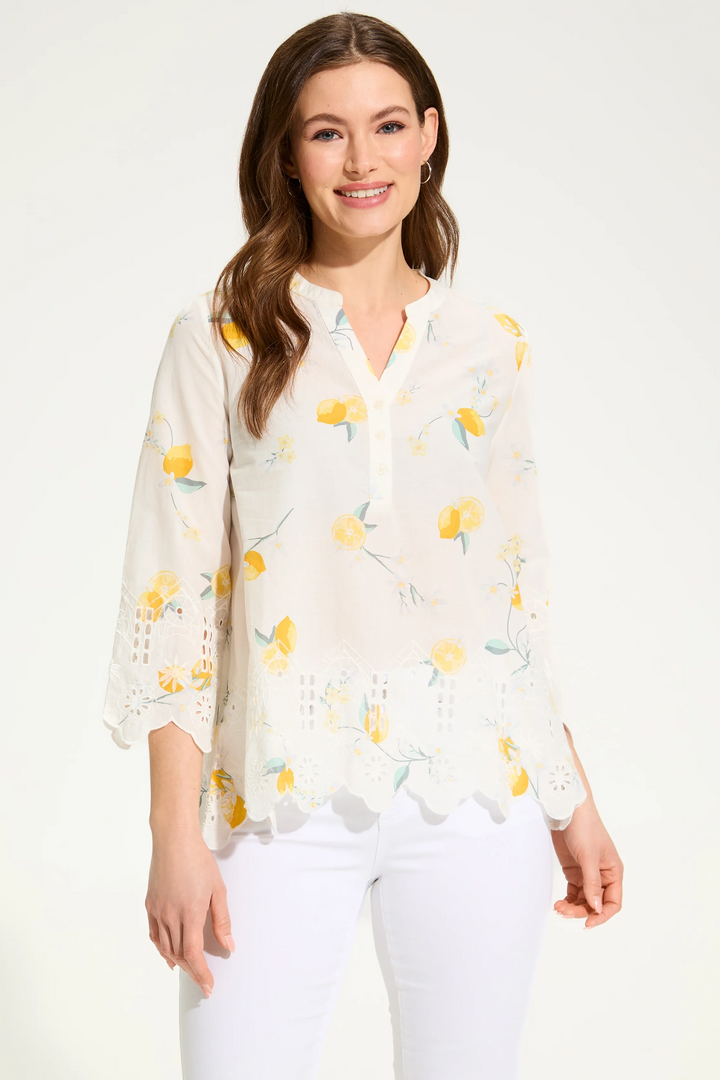 FDJ Spring 2025 This airy top features a playful cutout hem, delicate eyelet pattern and convenient button split v-neck. The 3/4 length light sleeves add just the right amount of coverage, while the ultra-lightweight fabric creates a breezy, semi-sheer effect perfect for layering.