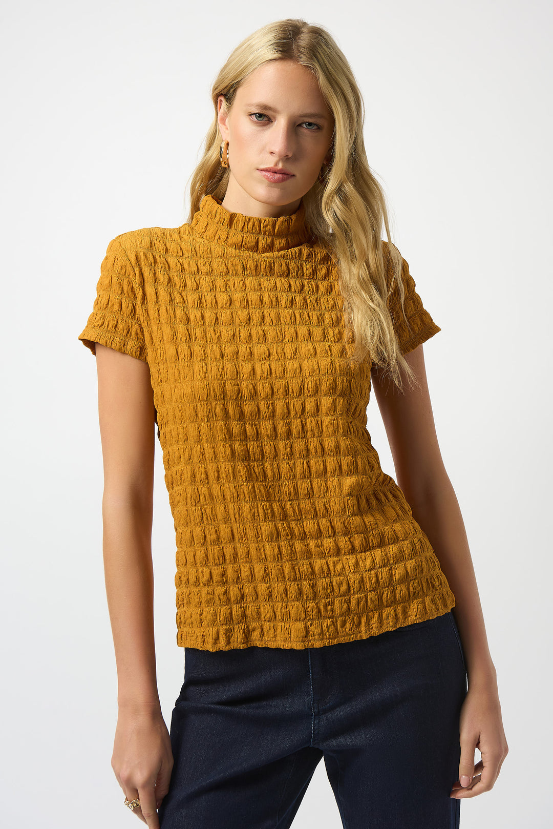 JOSEPH RIBKOFF Fall 2025 Featuring a high neckline and straight short sleeves, its unique bubble texture adds interest and some panache. Perfect for layering under a blazer or jean jacket, this top offers a polished look that transitions effortlessly from office to weekend.