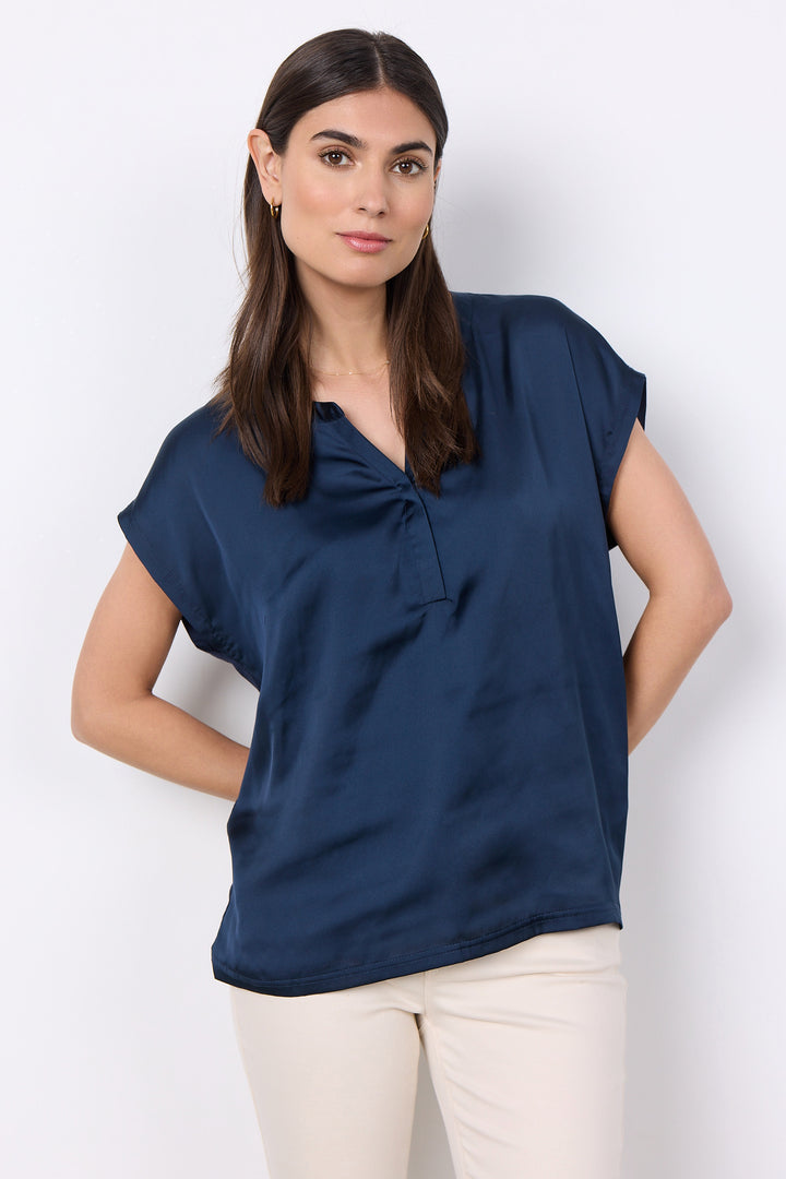 Soya Concept Fall 2025 This versatile Satin Front Split Neck Top offers endless styling options with its subtle satin shine, contrast plain back, and light, relaxed fit.