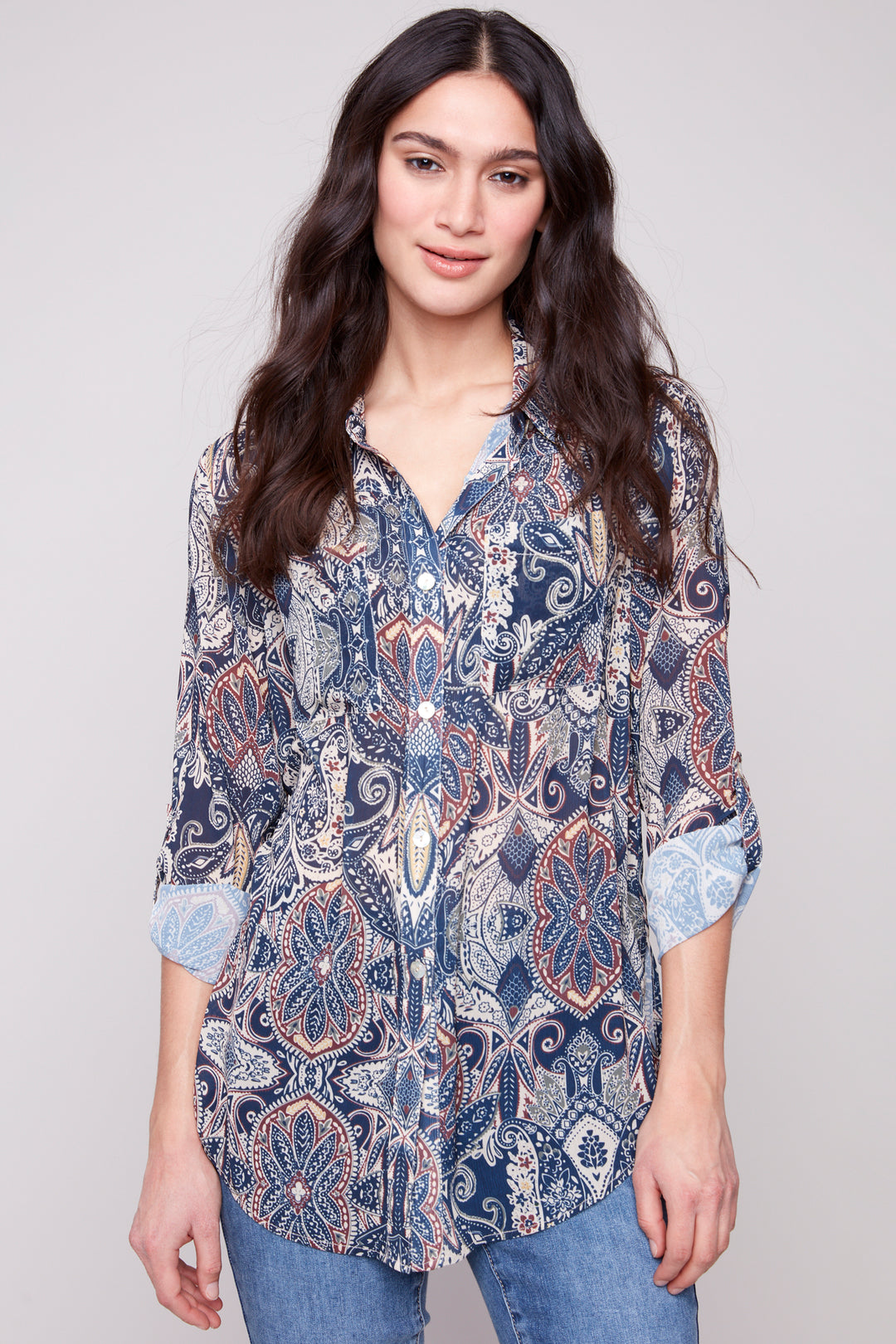 Charlie B Fall 2025 
This standout design brings a 'wow' feel to a classic shirt. It has a button up front, a classic collar and front chest pockets. Side slit cuts and roll up sleeves complete the classic yet modern look.