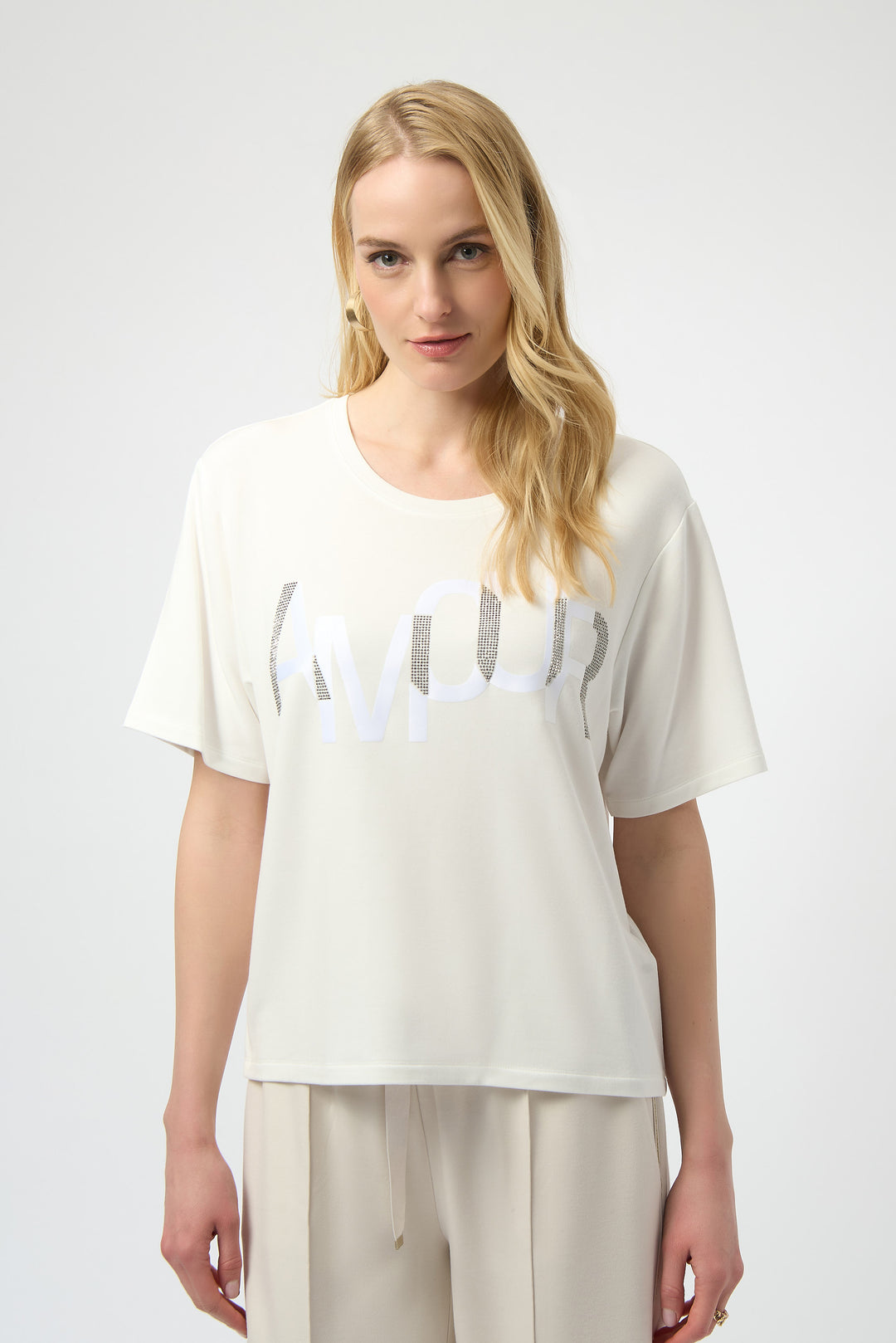 The Winter White Amour T-Shirt combines simplicity with a touch of sparkle, featuring short straight sleeves and a clean white design.
