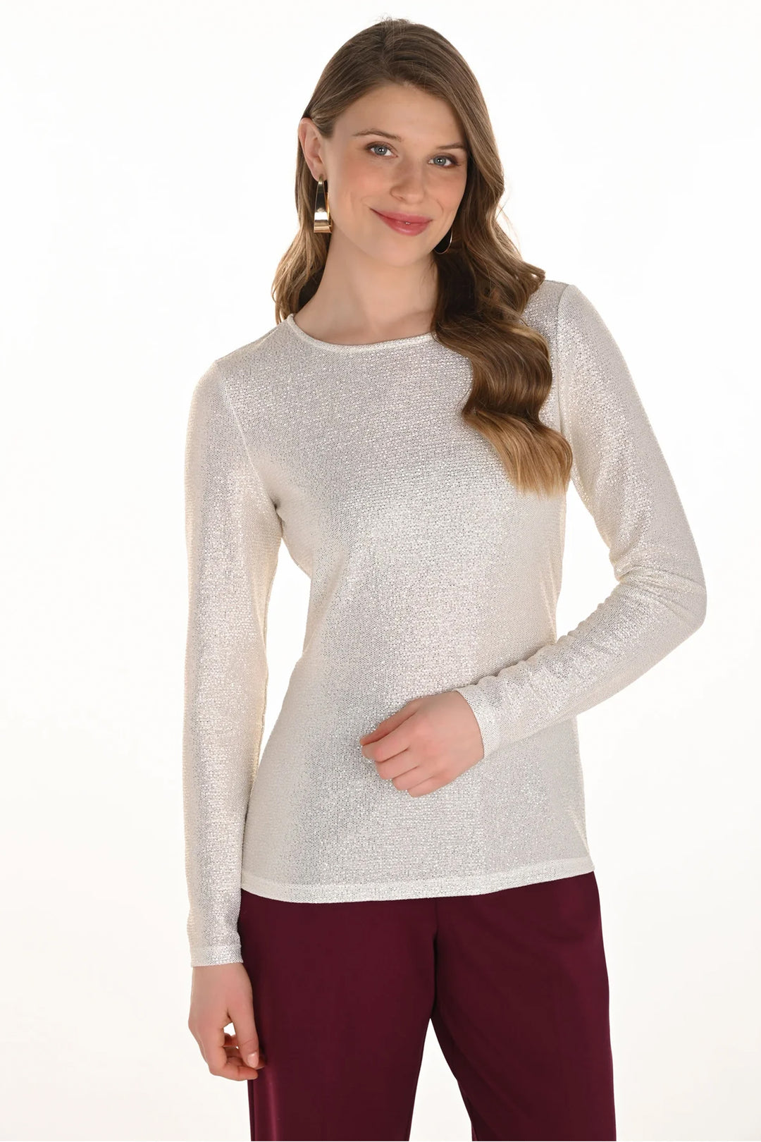 Frank Lyman Fall 2025 
eaturing a flattering crew neckline and a fitted silhouette, this unlined top ensures a sleek, comfortable fit. Delicate gold accents add subtle shine, making it perfect for both day and evening wear. 