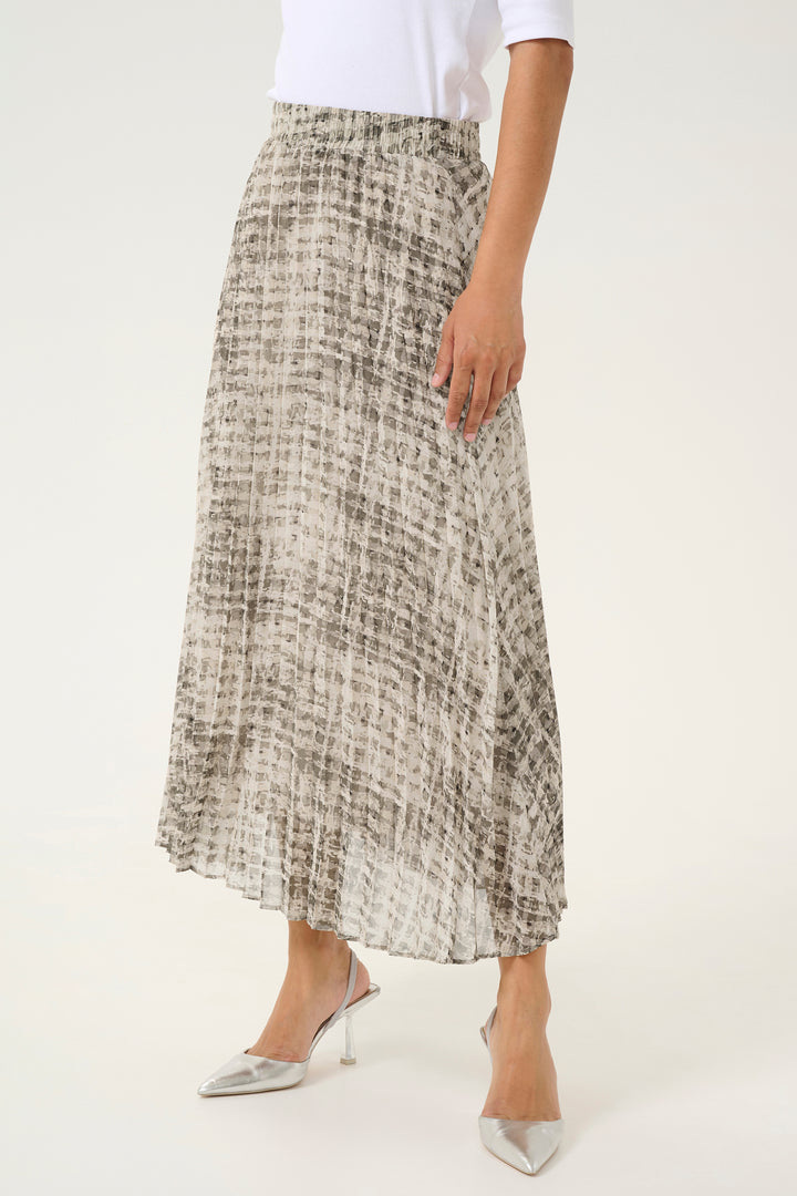 KAFFE Spring 2025  Look no further than our Grey Texture Check Pleated Skirt! This midi-length skirt features a fun and playful texture check design pattern and an A-shape to flatter any body type. 