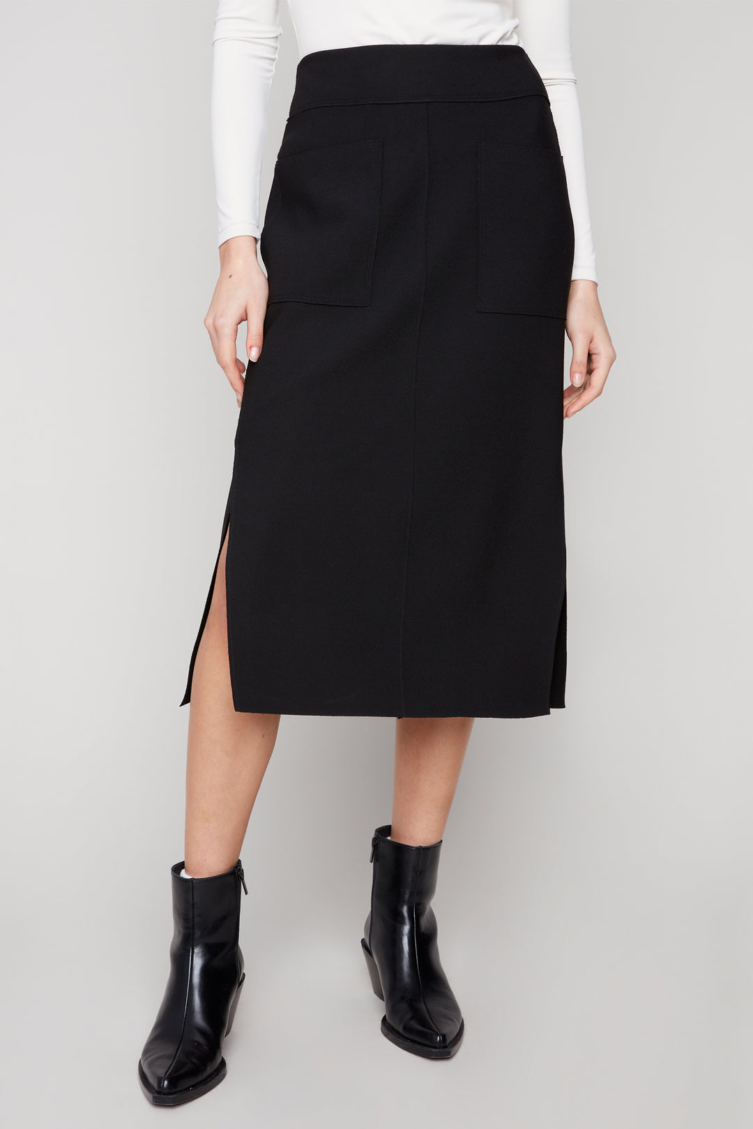 Charlie B Fall 2025
 With a knee length and side cut slits, this skirt is versatile enough to take you from the office to a night out! Pair it with a light sweater or a blouse for a stylish look this season.