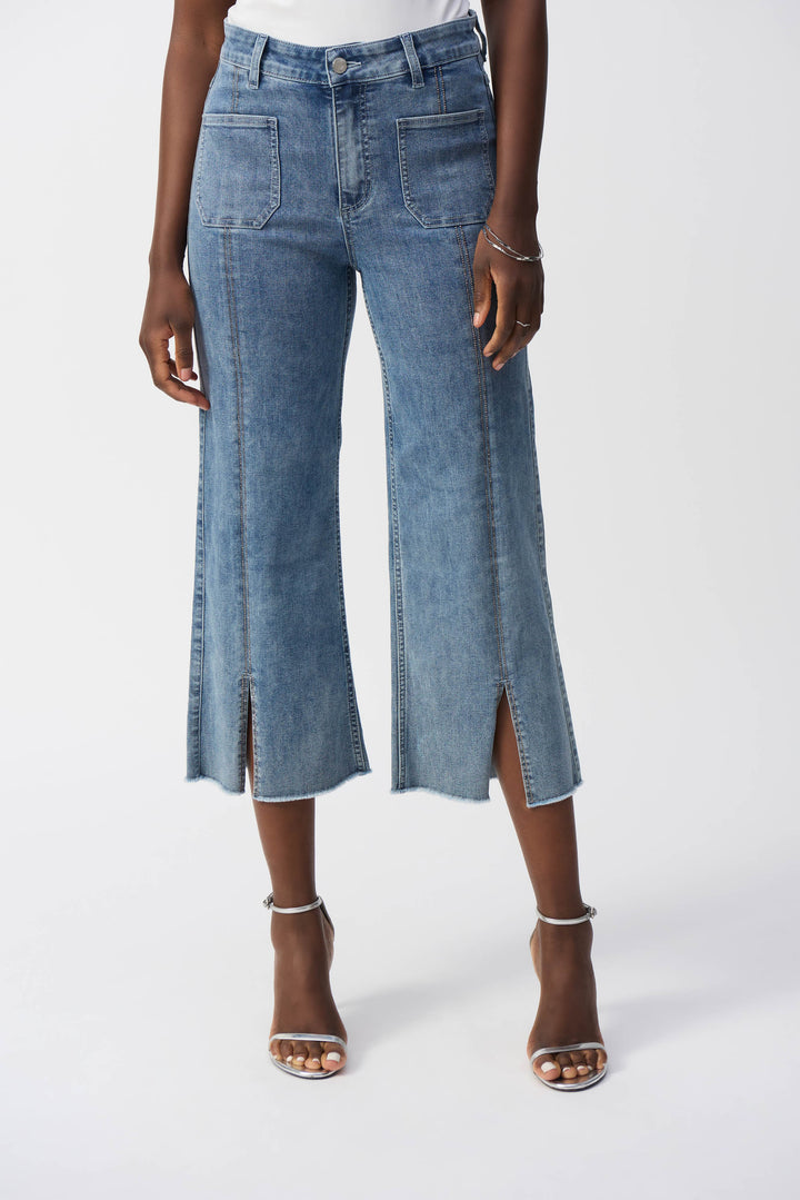 Joseph Ribkoff Spring 2025 The sleek split hem design adds a touch of sophistication while the bling rhinestones along the stitching offer subtle yet stylish detail.