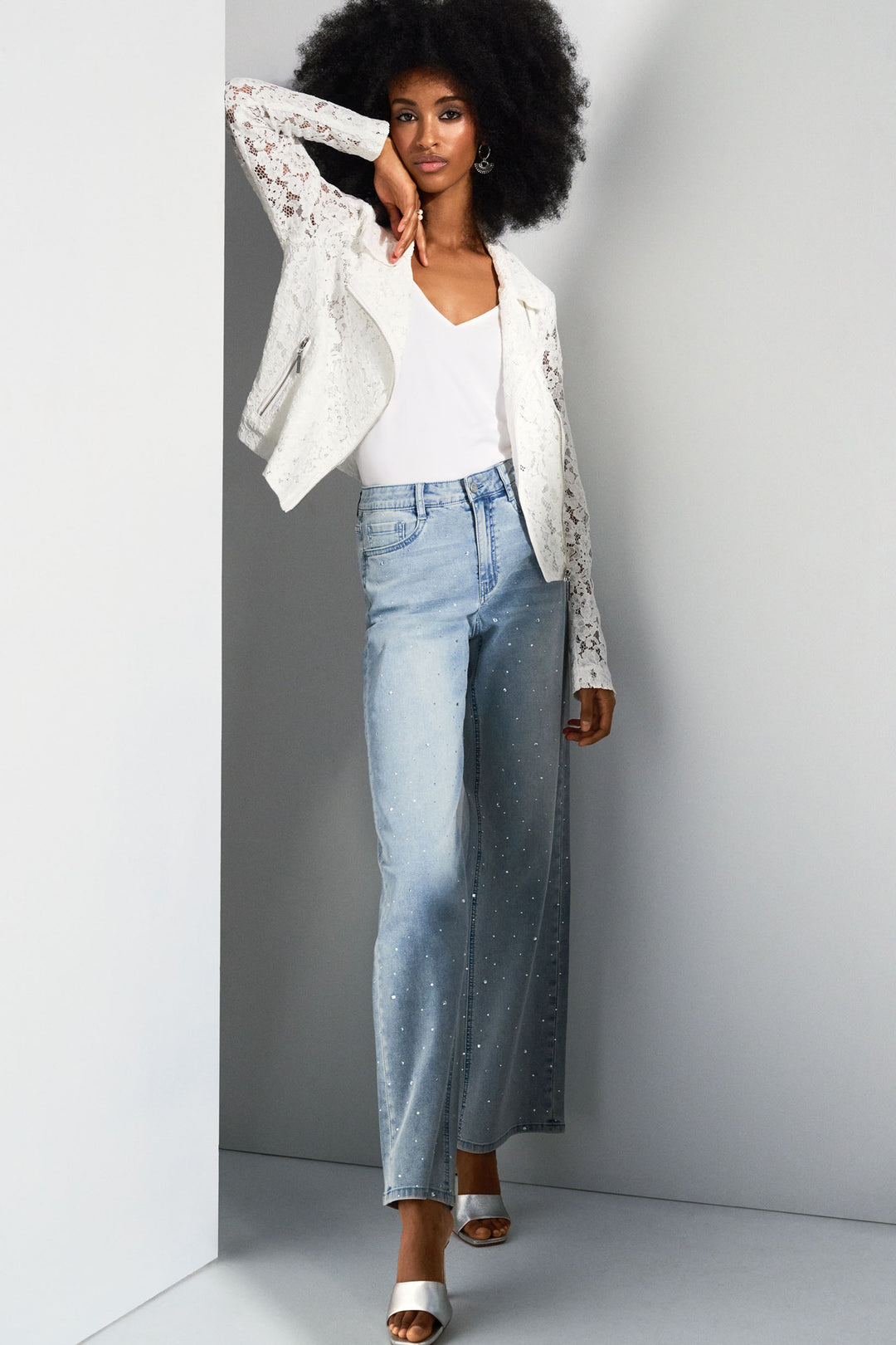 Joseph Ribkoff Spring 2025 Wide leg jeans are back in style, with crystals it brings all the flare of the 70s into the present! 