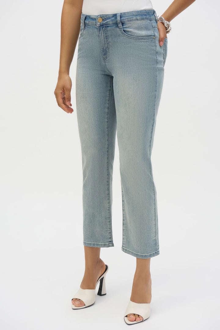 Joseph Ribkoff Spring 2025 The mid-rise fit and 4 pocket design provide a comfortable and practical pair of jeans, while the stylish crop hem adds a chic touch. Perfect for any occasion, this ankle length pair can be dressed up or down with a casual top and jacket.