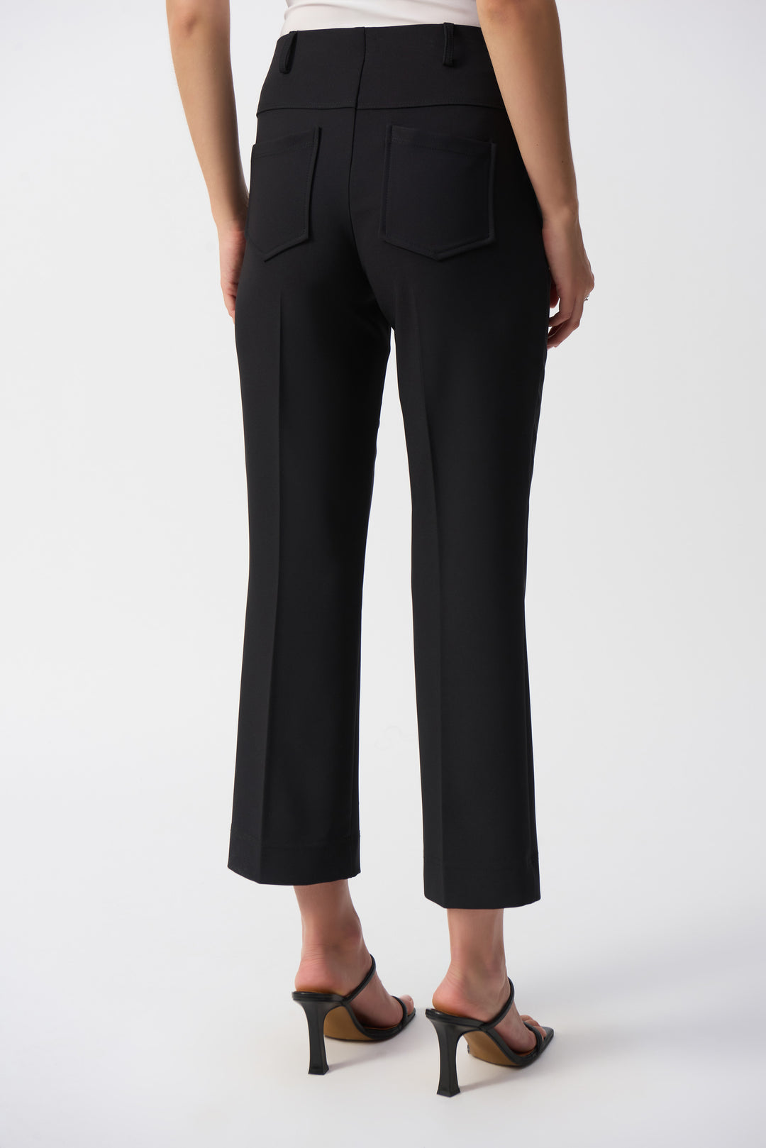 Joseph Ribkoff Spring 2025  With a cropped length, mid-rise waist, and back pockets, these sleek straight pants are both stylish and functional. 