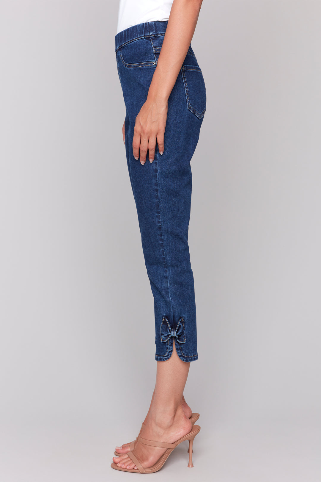 Charlie B Spring 2025 Made with stretch denim for the perfect slim fit and a cropped length, these jeans are designed for easy wear with a pull-on style. And don't forget the adorable bow detail at the hems for a touch of cuteness in every step!