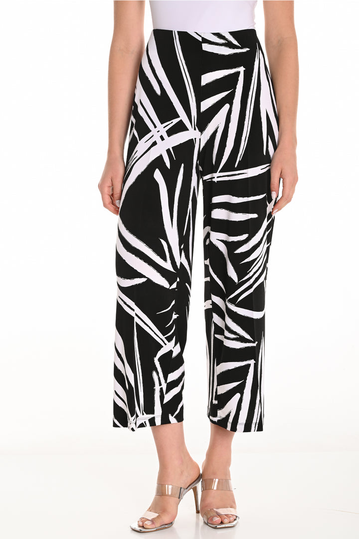 Frank Lyman Spring 2025 Featuring a high-waist and double stitch hems, these pants offer both style and comfort.