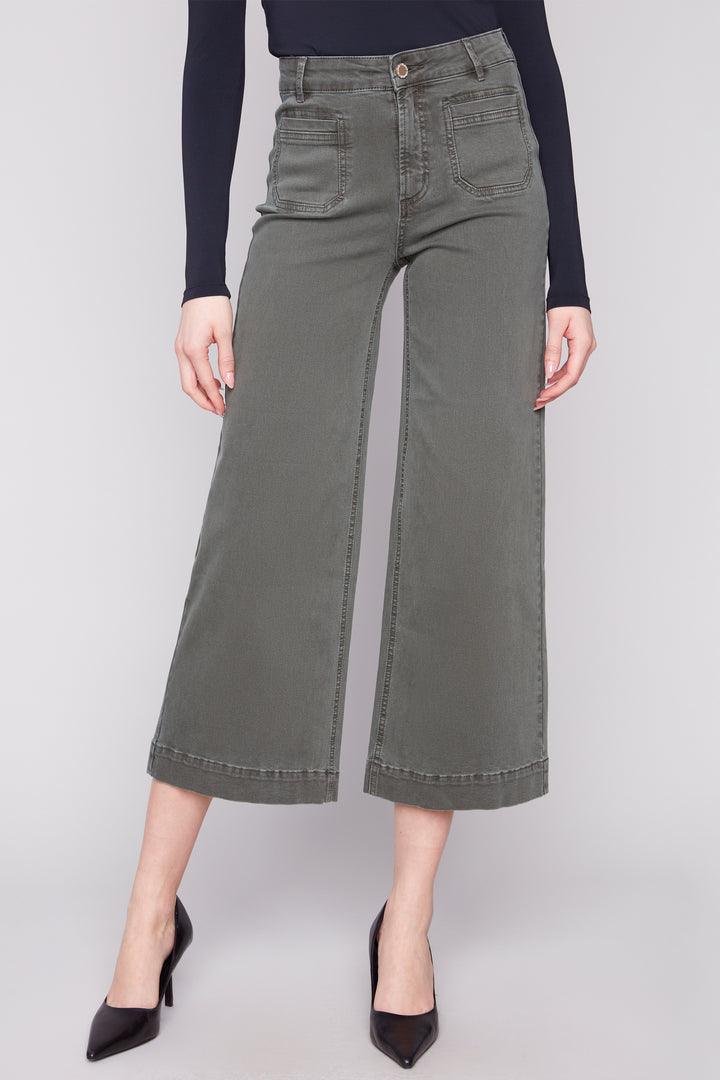 Charlie B Fall 2025 
 The modern flare hem design adds a stylish twist to the classic twill pant. With a regular rise and front patch pockets, these jeans are both functional and trendy. 
