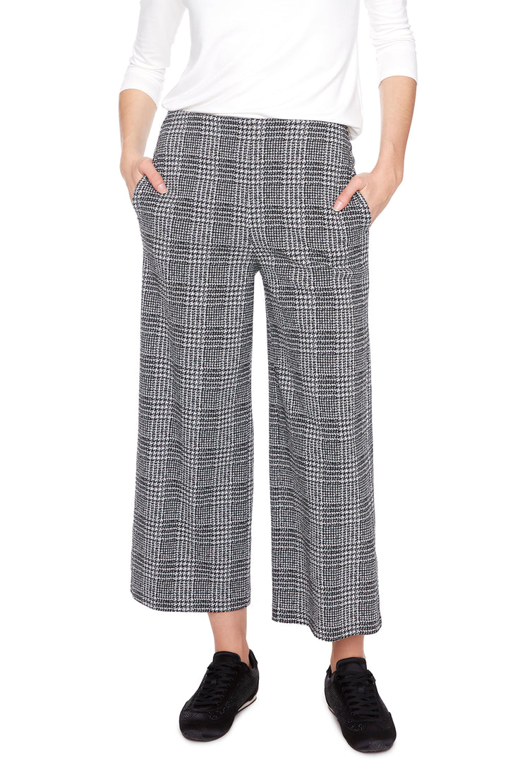 UP! Fall 2025 
 These high-waisted, wide-leg trousers feature a structured silhouette that keeps you looking sharp while feeling comfortable. Crafted from a textured glencheck fabric, they add a subtle pattern perfect for smart casual or office wear. 