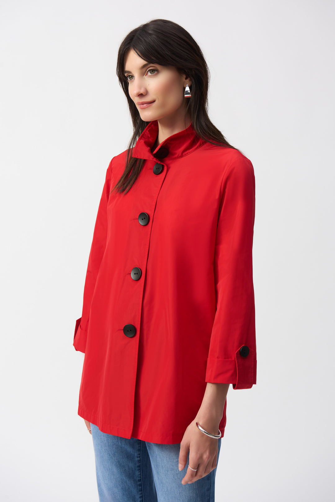 Joseph Ribkoff Spring 2025 Don this trapeze jacket featuring a four button closure and 3/4 length straight sleeves for a sophisticated touch. The rolled button cuffs add a touch of refinement to this original light jacket.