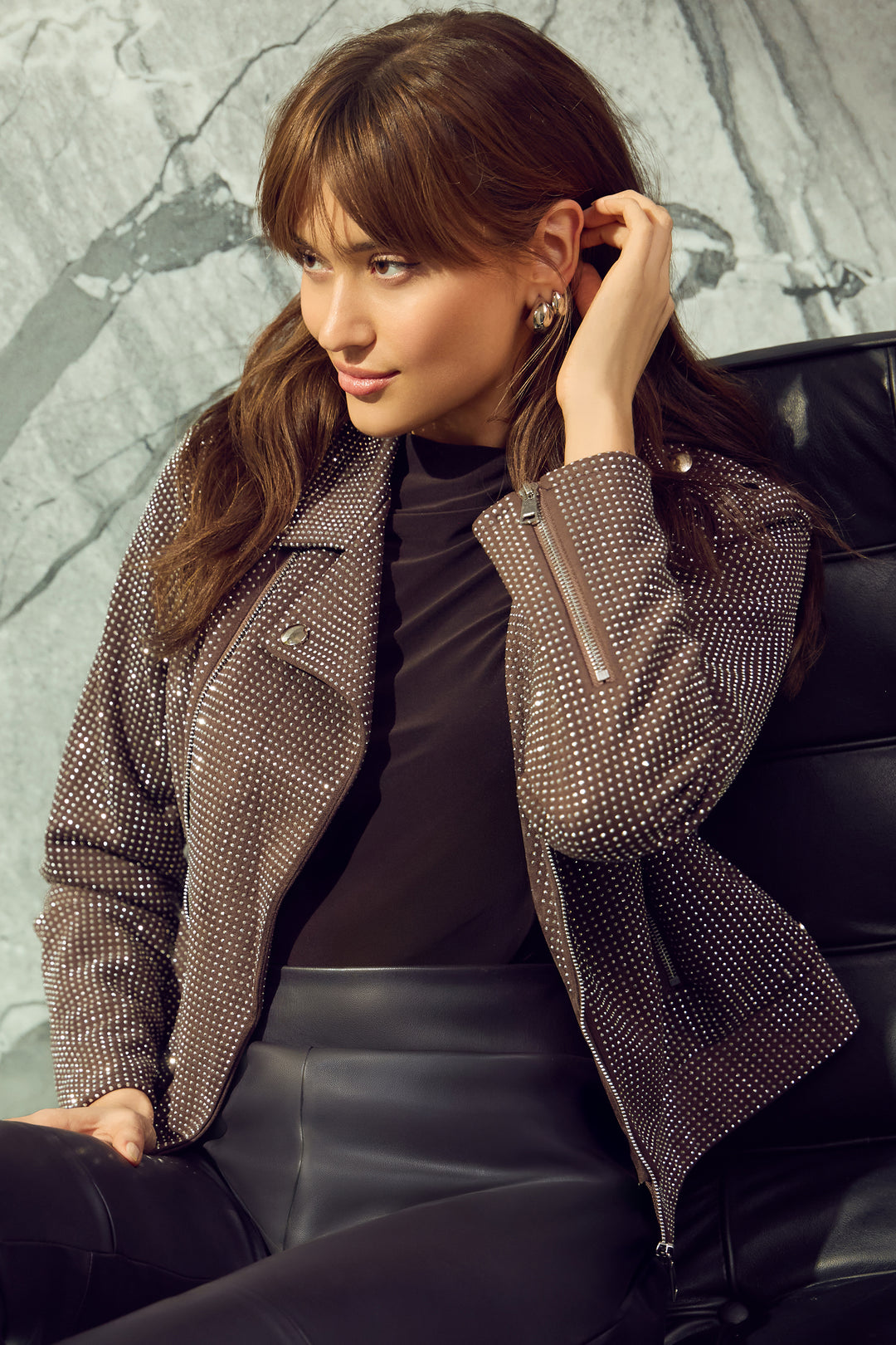 Frank Lyman Fall 2025 The light fall colour is sure to make a statement, while the rhinestone studs add a touch of sparkle throughout! Elevate any outfit with this must-have piece!