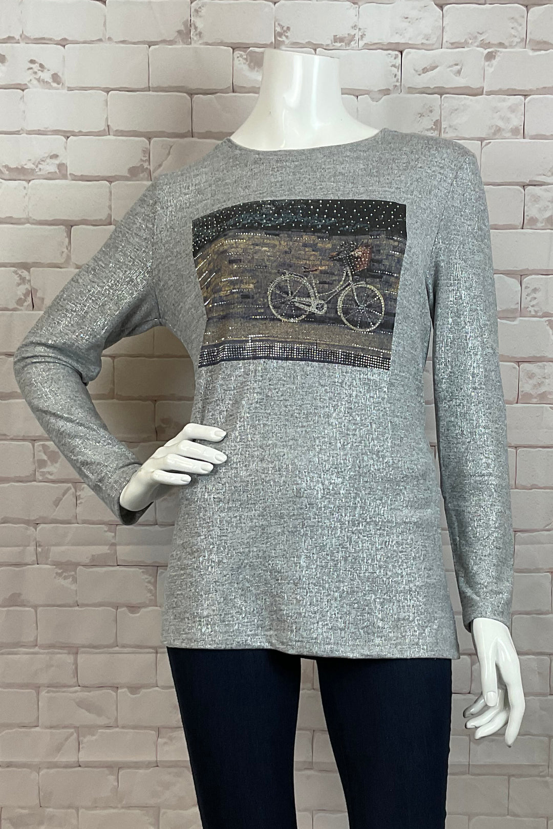 Ness Fall 2024  The round neckline and full length sleeves make it easy and comfortable to wear, while the unique bicycle motif adds a touch of fun and playfulness to any outfit. 