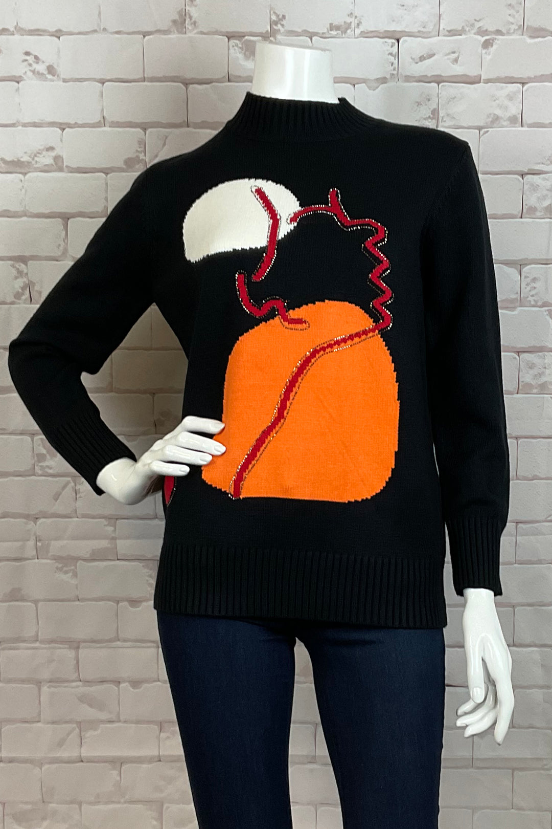 Ness Fall 2024 Made from light knit sweater material, this sweater top features a mock neck and interesting orange abstract print. With a neat ribbed knit pattern on the cuffs and hem, you'll feel both comfortable and stylish.