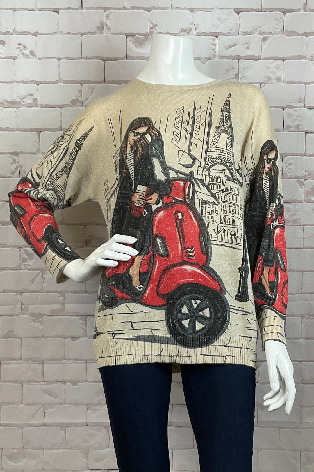 Ness Fall 2024  Made from light knit sweater material, this sweater top features a contrast crewneck and a cute girl on motor bike print on the front and sleeves. 