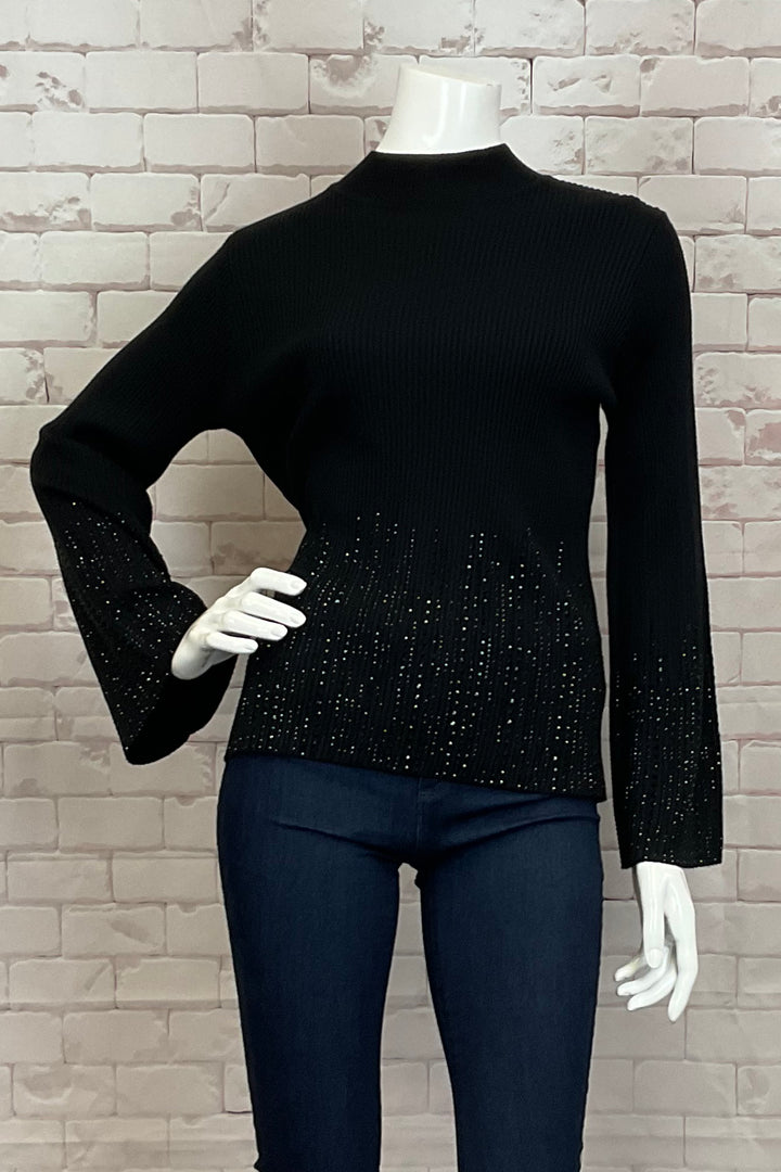 Leo & Ugo Fall 2024 With its luxurious bling studs on the lower half of the front and sleeves, this top exudes glamour and sophistication.