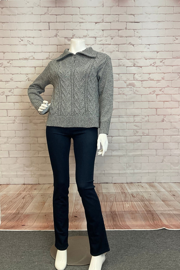 Cotton Country Fall 2024  Made with a nice cable knit design and flattering fit, this top features a zipper collar and full length sleeves for added convenience. 