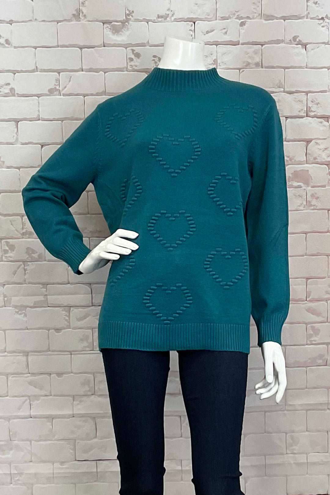 Variations Fall 2024 This sweater top features a contrast ribbed mock neck and hemline, perfect for pairing with jeans or even leggings. Show off your fun side with this playful and stylish piece!